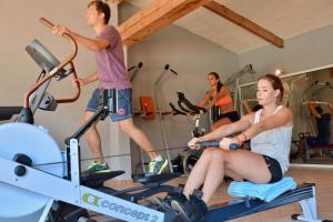 a group of people on bikes in a gym at Les Suites De Pertamina in Bonifacio