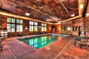 a swimming pool in a building with a ceiling at The Niobrara Lodge in Valentine