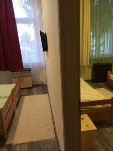 Ένα ή περισσότερα κρεβάτια σε δωμάτιο στο Harang Panzió