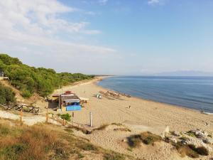 a view of a beach with people on it at Can Eugeni in L'Escala