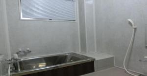 a bathroom with a sink and a window at Ryokan Suzukisou-10 tatami mats room No bath and toilet- Vacation STAY 17872 in Kyoto