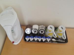 a table with a white mixer on top at Malvern Lodge Guest House- Close to Beach, Train Station & Southend Airport in Southend-on-Sea