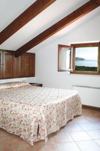 Кровать или кровати в номере Residence Il Casale