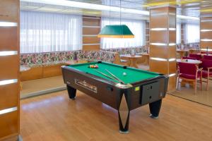 a billiard table in a room with a table at htop Summer Sun #htopEnjoy in Santa Susanna
