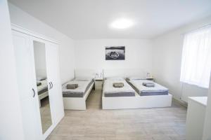 Postel nebo postele na pokoji v ubytování Penzion U parku Třeboň
