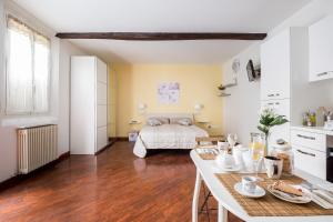 a living room with a bed and a table at Borgo Pietralata in Bologna