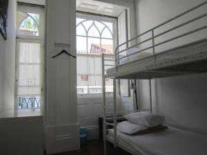 Postel nebo postele na pokoji v ubytování Hostel Prime Guimaraes