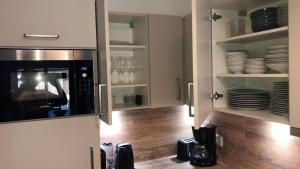 A kitchen or kitchenette at Grossglockner Chalets Zell am See