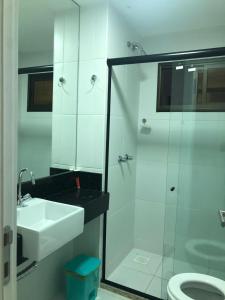 a bathroom with a sink and a shower and a toilet at Wai Wai Cumbuco Eco Residence in Cumbuco