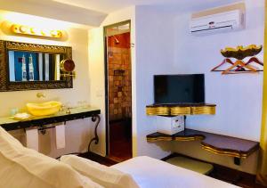 TV a/nebo společenská místnost v ubytování Hotel Herencia By Hosting House