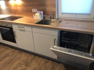 A kitchen or kitchenette at Grossglockner Chalets Zell am See