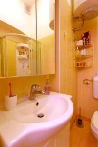 a bathroom with a sink and a toilet at Apartment LAUREL Center Opatija in Opatija +30 photos