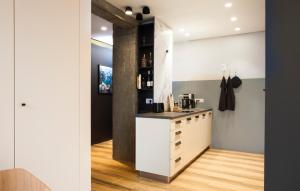 a kitchen with white cabinets and a counter top at Set-up Design in Sofia