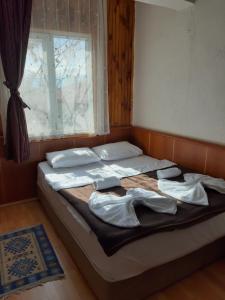 Postel nebo postele na pokoji v ubytování Mustafa Hotel