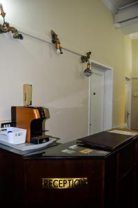a kitchen with a coffee maker on a counter at Soggiorno La Cupola Guesthouse in Florence