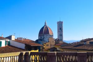 a view of a city with a clock tower at Soggiorno La Cupola Guesthouse in Florence