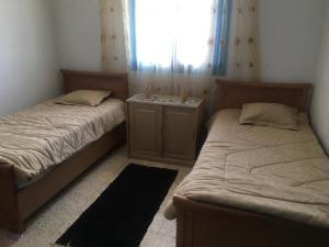 Tempat tidur dalam kamar di Sidi Mansour Route Touristique