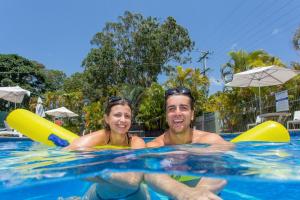 a man and a woman in a swimming pool at Ingenia Holidays Noosa North in Tewantin +29 photos