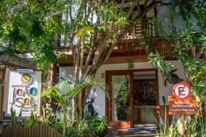 a building with a no parking sign in front of it at Pousada João Sol in Praia do Forte