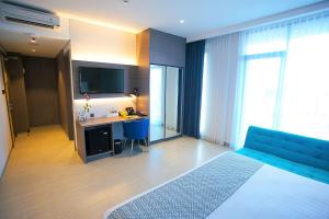 Postel nebo postele na pokoji v ubytování BW inn Belitung