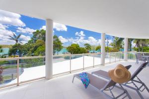 a balcony with a view of the ocean at Offshore Noosa Resort in Noosaville
