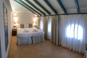 Łóżko lub łóżka w pokoju w obiekcie Turistic Apartment Sevillanos SL