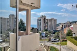 a view of the city from the balcony of a building at Apartment Tina in Petrovac na Moru