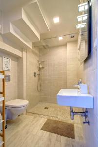 a bathroom with a sink and a toilet at Loftas Nidos centre in Nida