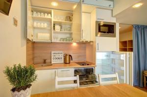 Η κουζίνα ή μικρή κουζίνα στο Loftas Nidos centre +14 φωτογραφίες