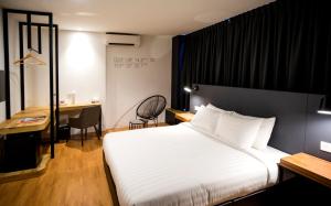 เตียงในห้องที่ H Boutique Hotel Xplorer Kota Damansara