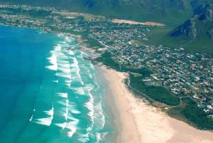 an aerial view of a beach next to the ocean at Dawn's Place in Hermanus