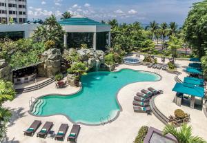 an overhead view of a swimming pool at a resort at Diamond Hotel Philippines in Manila