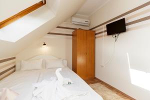 Posteľ alebo postele v izbe v ubytovaní Almafa Apartmanház
