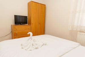 Posteľ alebo postele v izbe v ubytovaní Almafa Apartmanház