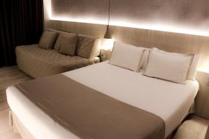 Postel nebo postele na pokoji v ubytování Hotel Bernat II 4*Sup