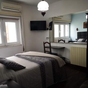 Katil atau katil-katil dalam bilik di Hotel 4 Estacoes