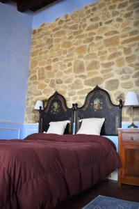 Un pat sau paturi într-o cameră la Agriturismo Baglio Pollicarini