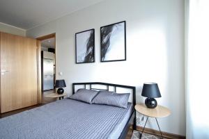 Cama ou camas em um quarto em Jõe Apartments