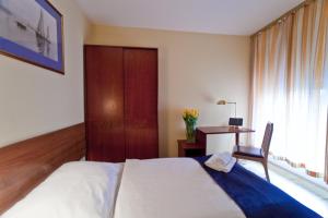 Cama o camas de una habitación en Apartamenty Pod Lwem