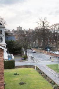 a view of a street in a city with a building at Hampden Apartments - The Henry in Windsor