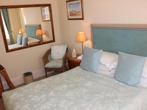Кровать или кровати в номере Trafalgar House