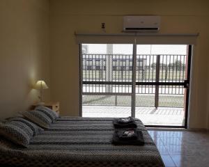 Postel nebo postele na pokoji v ubytování City Apartments Formosa