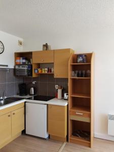 Kuchyň nebo kuchyňský kout v ubytování Résidence Les Pélerins + 5 fotografií