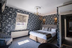 A bed or beds in a room at The Spa Hotel 