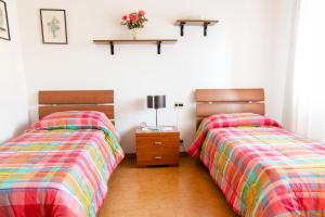 Katil atau katil-katil dalam bilik di Casa Paola