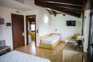 Postel nebo postele na pokoji v ubytování Hotel Venini