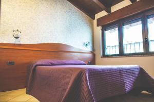 Postel nebo postele na pokoji v ubytování Hotel Venini