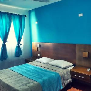 Ένα ή περισσότερα κρεβάτια σε δωμάτιο στο Figaro Hotel Samana