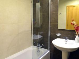 a bathroom with a shower and a sink at Tas-Sellum Residence in Mellieħa