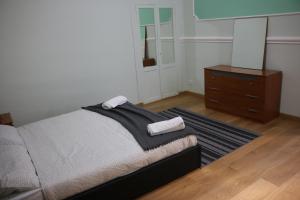 Postel nebo postele na pokoji v ubytování R.T. HOUSE'S